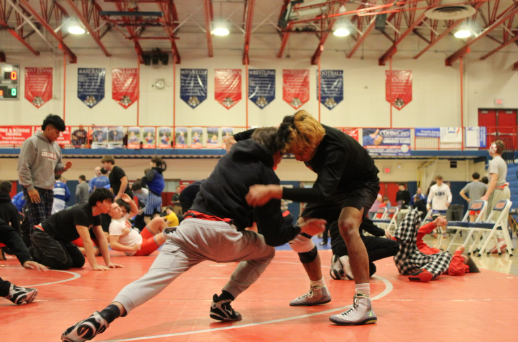 Junior Tesher Schrimpft (left) and Senior Gavyn Hanshew (right) warmup during the 2026 Conner Invitational Wrestling Tournament. (Photo courtesy of Oak Hills Mat Scots)
