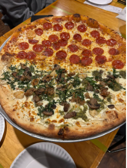 Chameleon’s Pizza famous new-york styled pie; half bianca, half pepperoni.