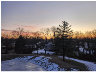 The picture shows the start of a sunrise at 7:15, 25 minutes after I had woken up. Most students get up before the sun has fully risen, which can result in tiredness due to the lack of light. 

