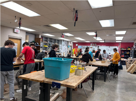 Mr Wandsnider fourth bell class in the middle of working on their wooden box project.
