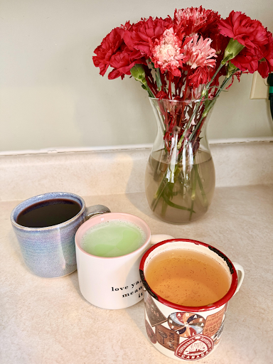 Photo of 3 different teas mentioned, elderberry tea to the far left, green tea matcha in the middle, chamomile tea to the far right.