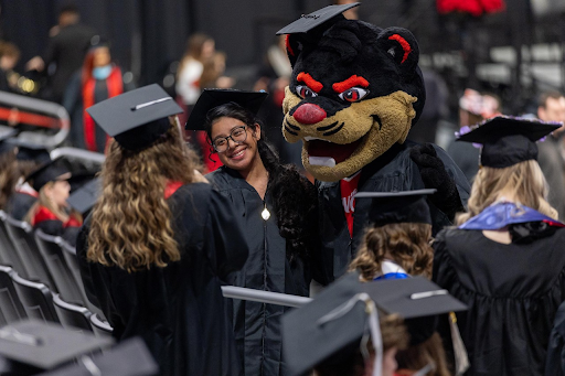 The University of Cincinnati Bearcat helps graduates celebrate at Fifth Third Arena