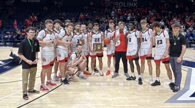 The Oak Hills basketball team displayed their awards after a triumph against St Xavier, advancing to the Elite Eight
