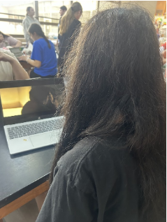 A straight woman sits, watching the show “Heated Rivalry”. She showcases the constant traction gay shows gain from straight women.