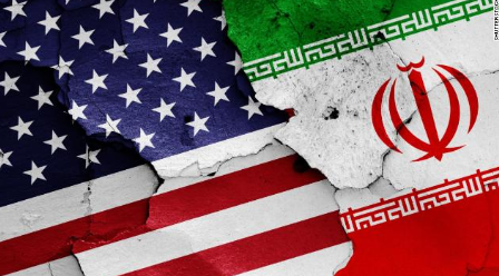 The two flags of US and Iran clash, symbolizing their long history of conflict. Photo Creds: CNN
