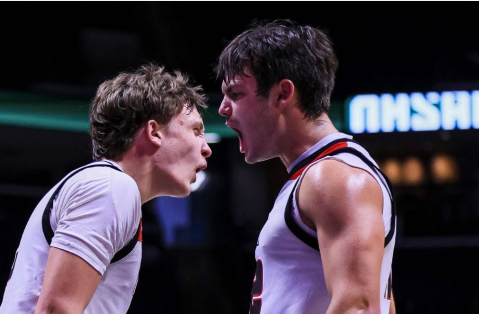 Teammates Kraus and Kornmann celebrate after being fouled on a tough layup