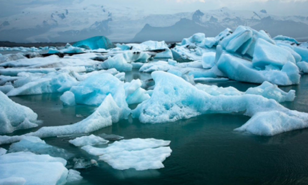Due to the increasing temperatures of Earth, glaciers and icebergs are melting, causing sea levels to rise. Photo by George Monbiot via The Guardian